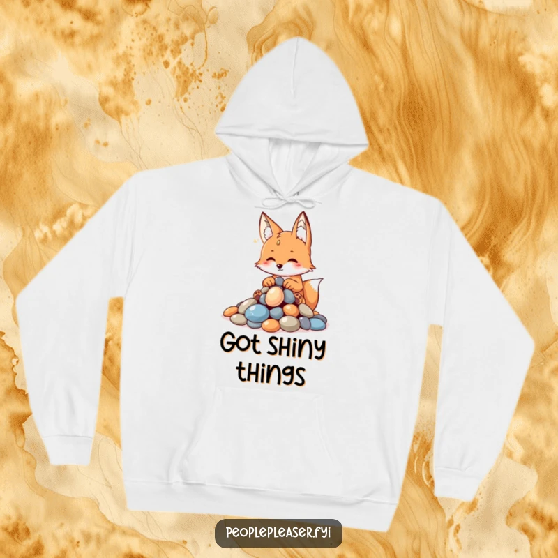 Funny fox hoodie, meticulously arranging a pile of shiny pebbles, embodying a clever and organized collector with a playful demeanor.